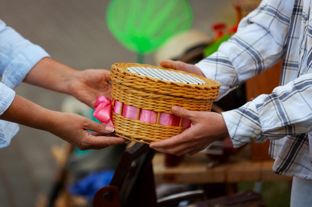 Two people are exchanging Coconut Shell Products in Andaman.