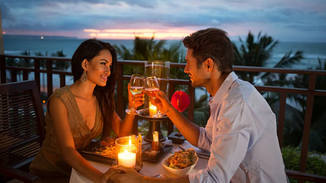 Couple enjoying candlelight dinner by the sea during Andaman honeymoon trip

