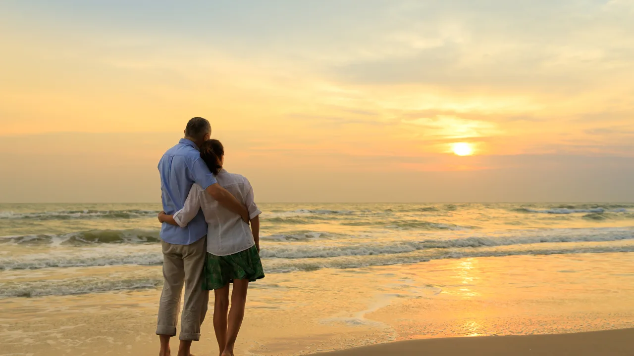 Couple enjoying sunset beach walk during Andaman honeymoon trip