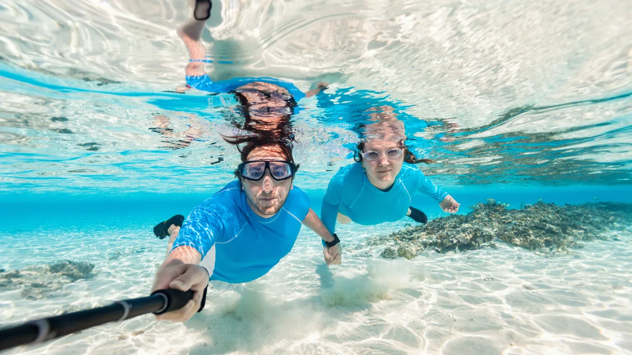 Couple snorkeling in clear waters during Andaman honeymoon trip

