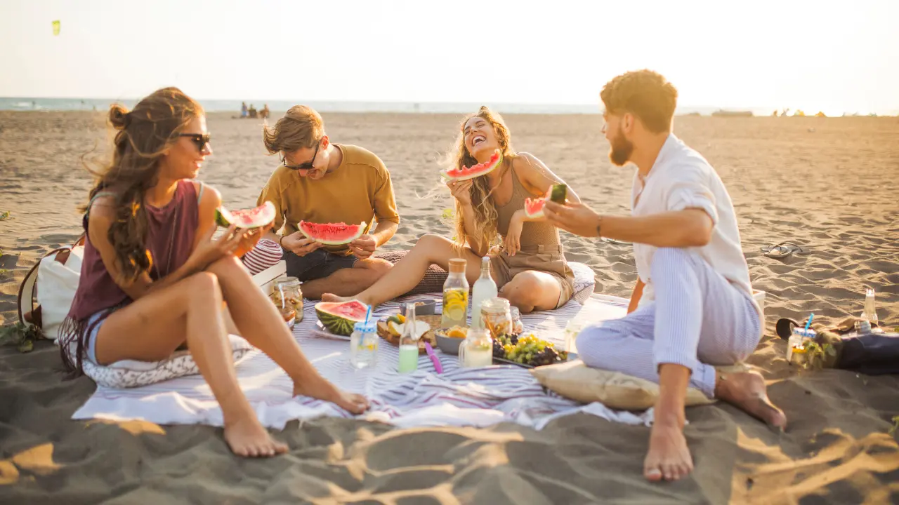 Friends enjoying a beachside picnic at Kalapathar Beach
