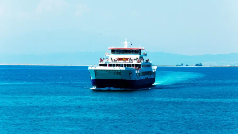 Passenger ferry cruising on the turquoise sea in daylight